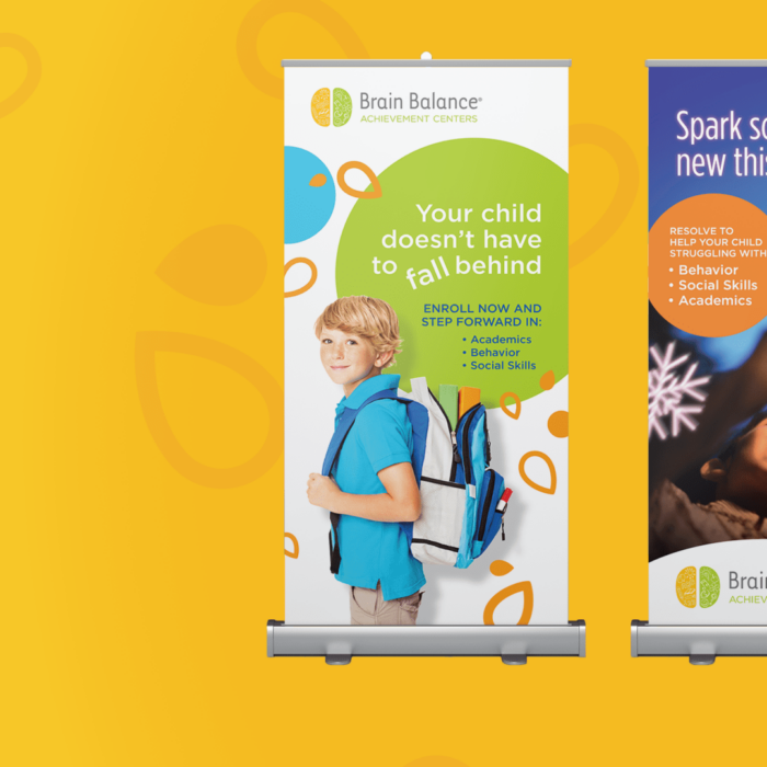 Two banners with Brain Balance branded imagery on top of a yellow background