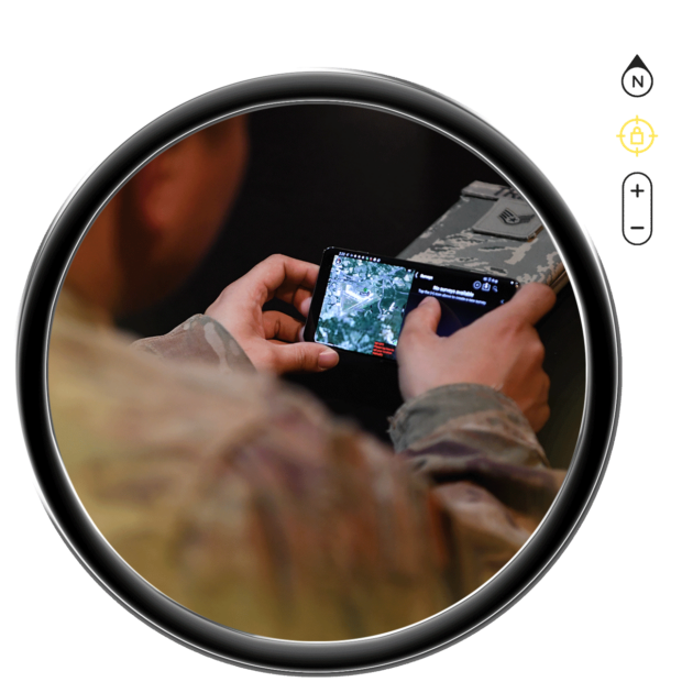A military person using the TAK software on an phone